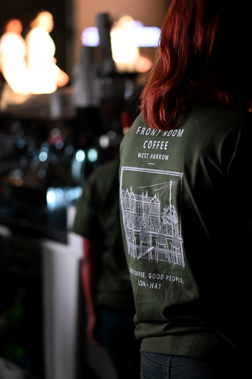 Front Room Coffee team member working behind the event bar