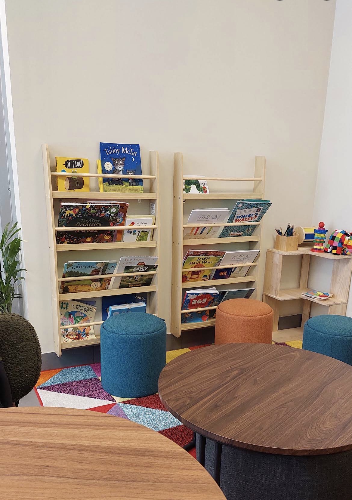 Children’s books and colourful seating in the café